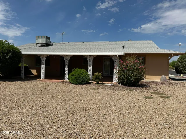 a view of a house with a yard and garage