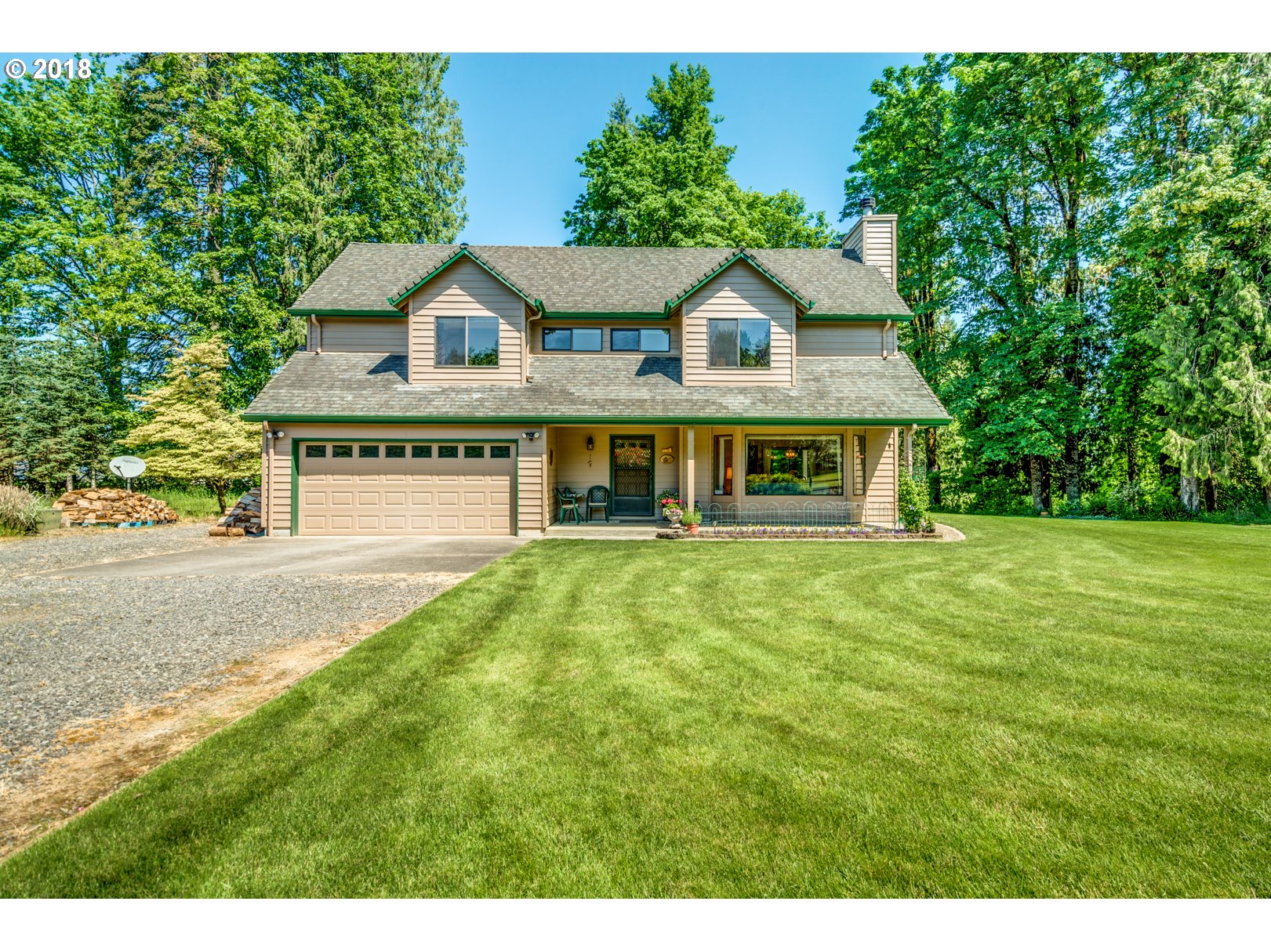 35133 Southeast Homan Road Gresham, OR 97080 - Photo 1 of 32 a front view of a house with a yard