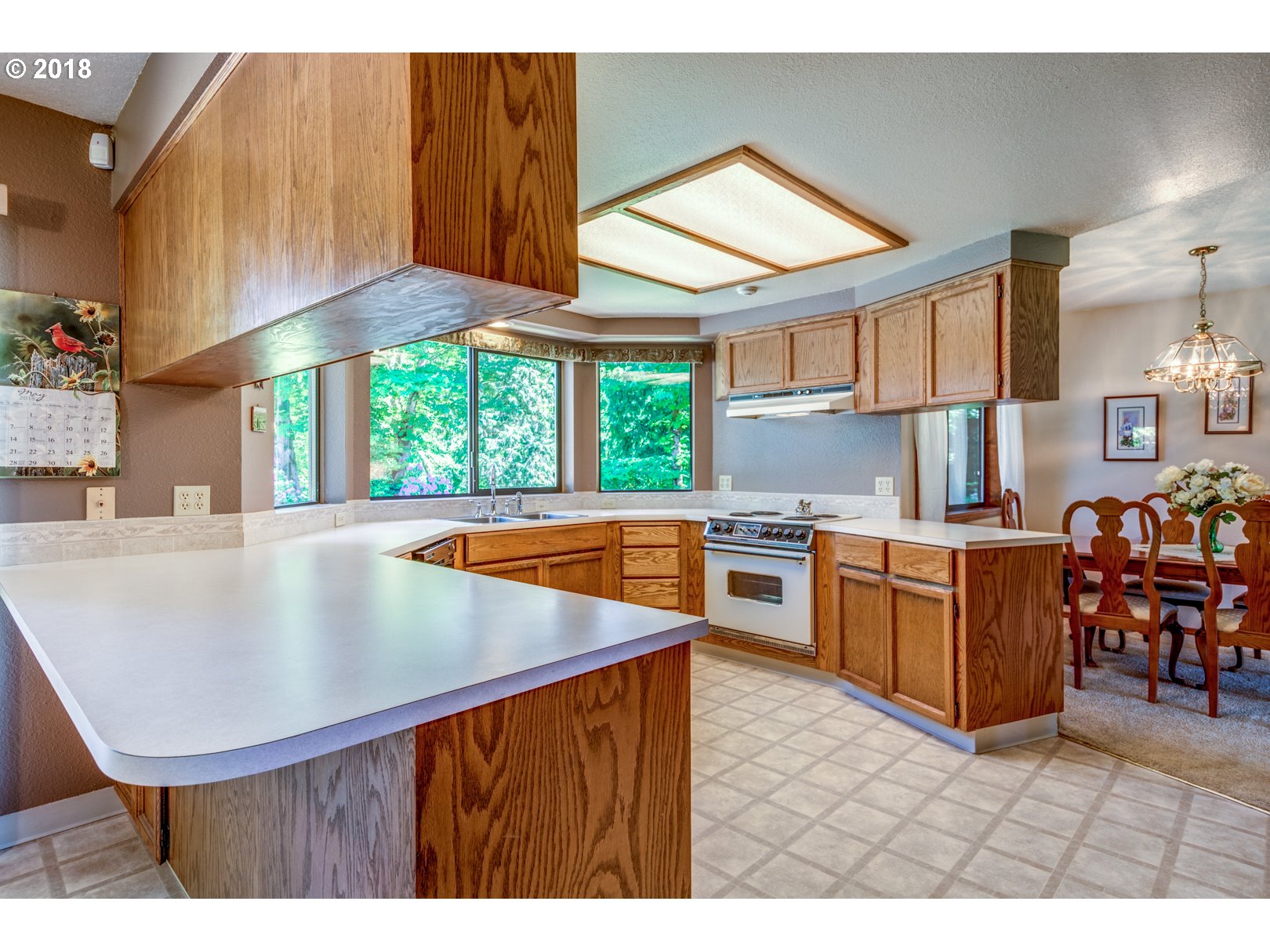 35133 Southeast Homan Road Gresham, OR 97080 - Photo 4 of 32 a kitchen with stainless steel appliances kitchen island granite countertop a stove a sink and a refrigerator