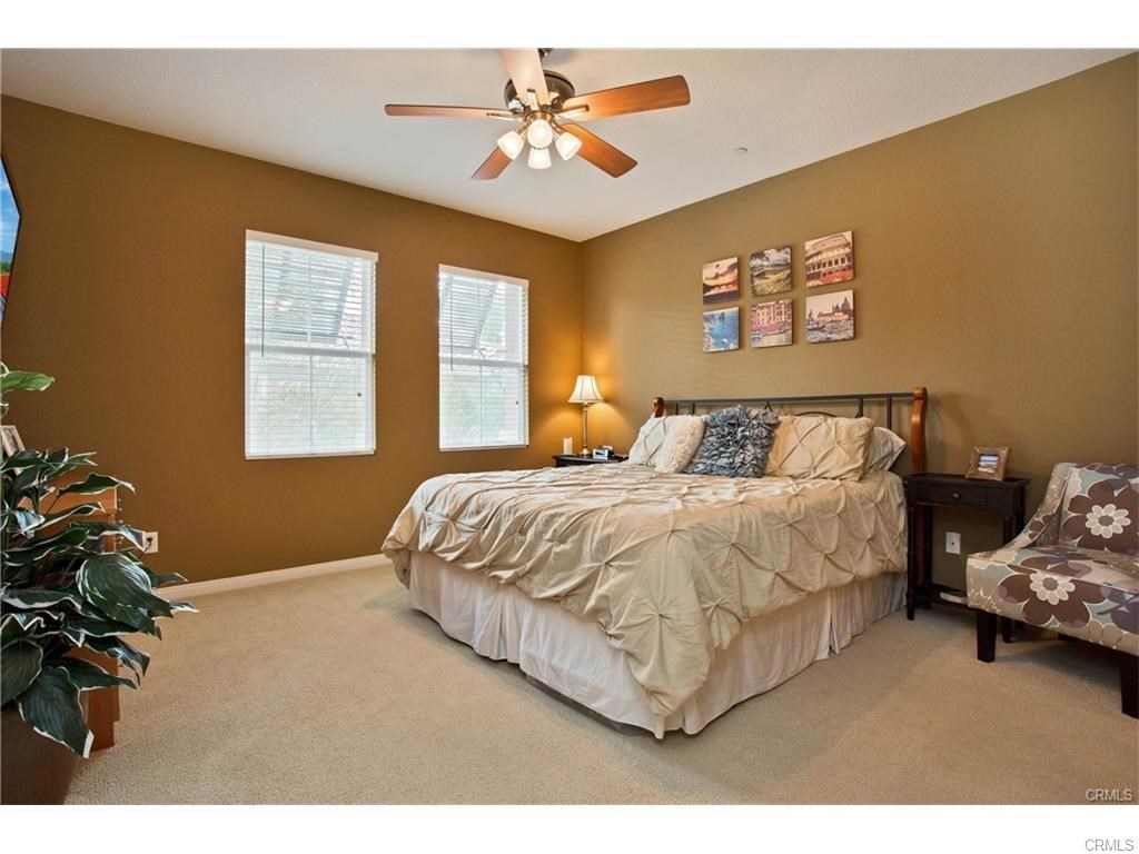 21 Corte Javier San Clemente, CA 92673 - Photo 16 of 32 a bedroom with a bed and a chandelier