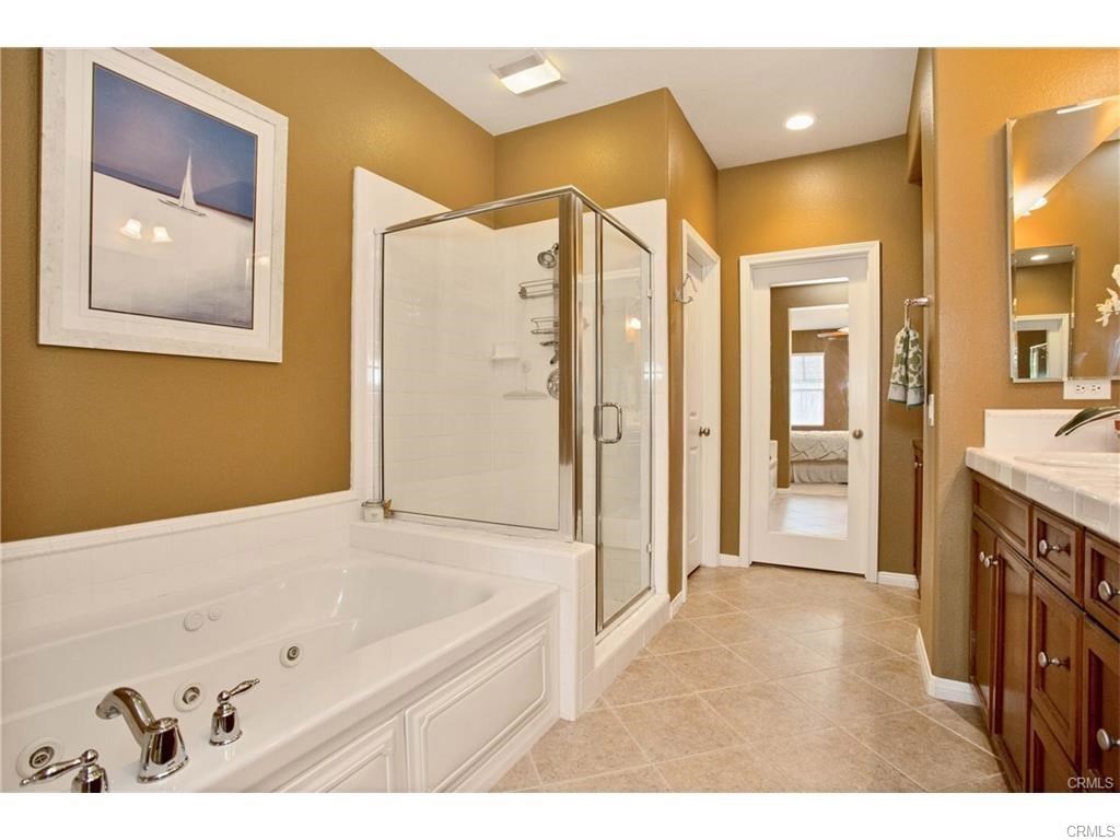 21 Corte Javier San Clemente, CA 92673 - Photo 18 of 32 a bathroom with a tub a sink and mirror