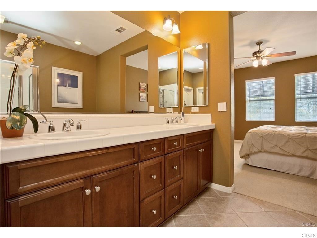 21 Corte Javier San Clemente, CA 92673 - Photo 19 of 32 a spacious bathroom with a double vanity sink and mirror with bathtub