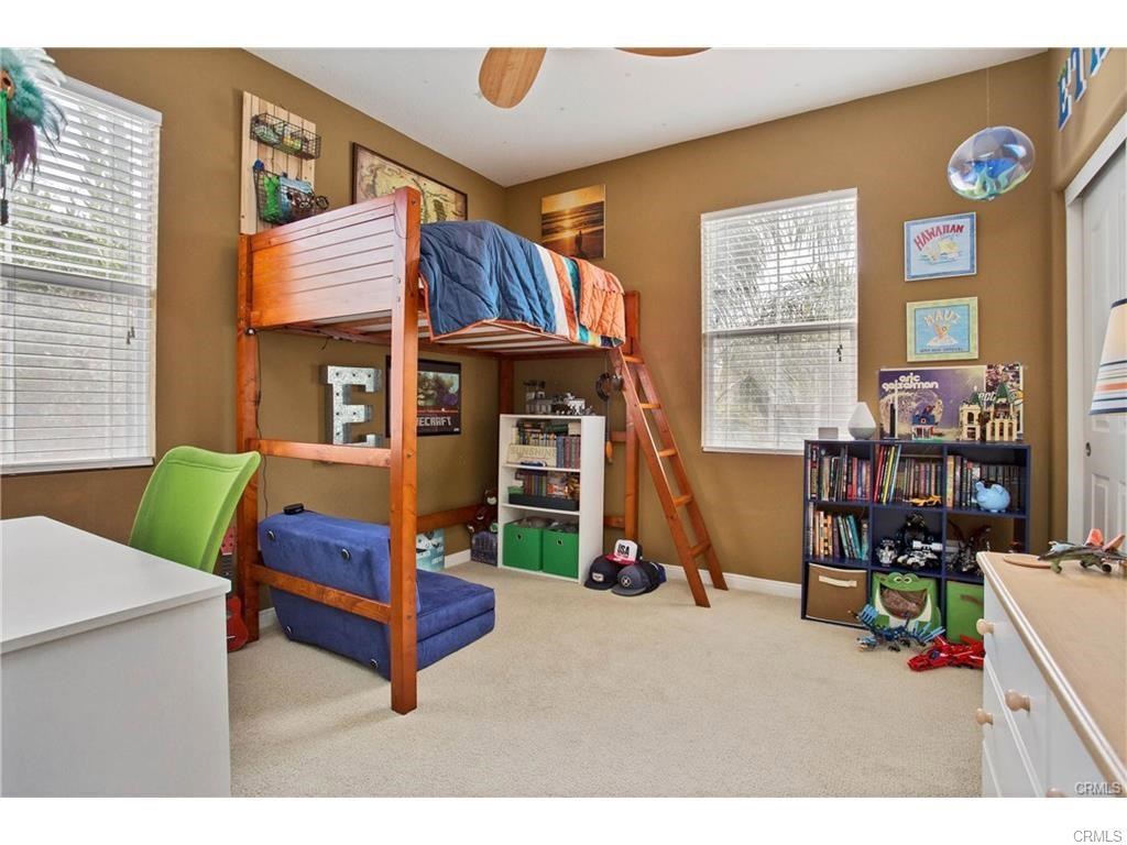 21 Corte Javier San Clemente, CA 92673 - Photo 20 of 32 a living room with furniture a fireplace and large windows