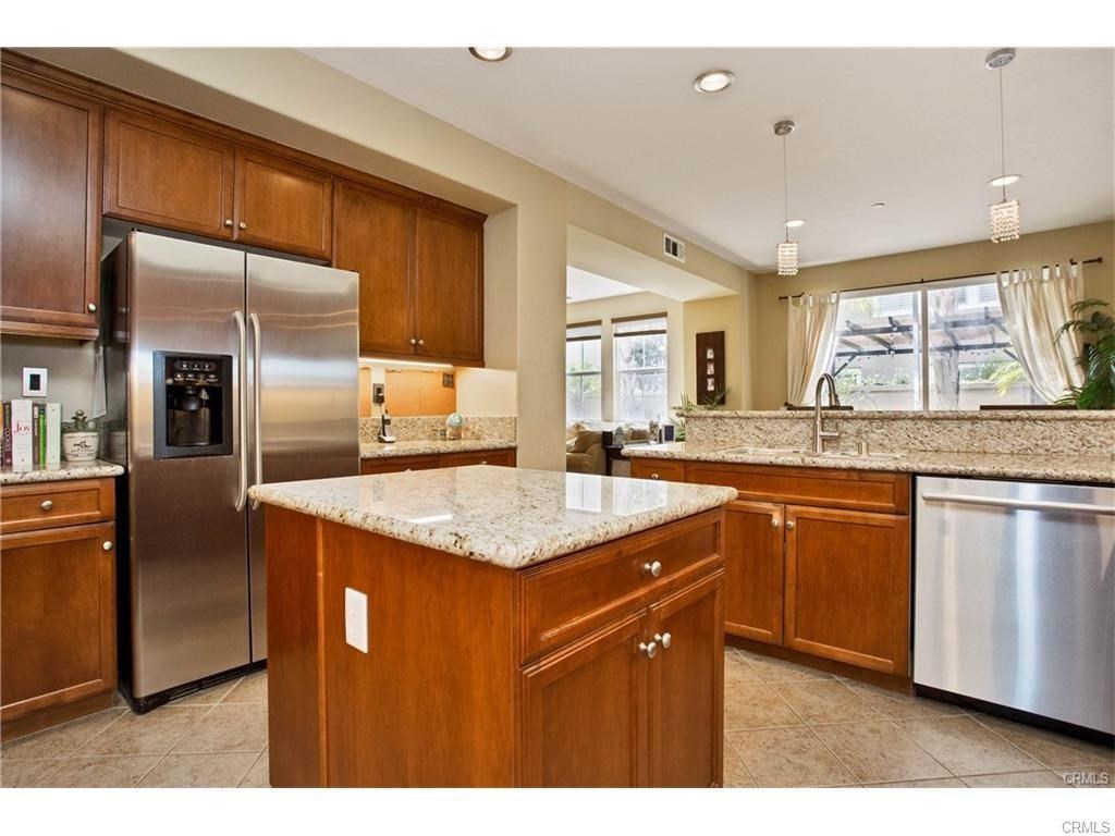 21 Corte Javier San Clemente, CA 92673 - Photo 2 of 32 a kitchen with stainless steel appliances granite countertop a sink a stove and a refrigerator