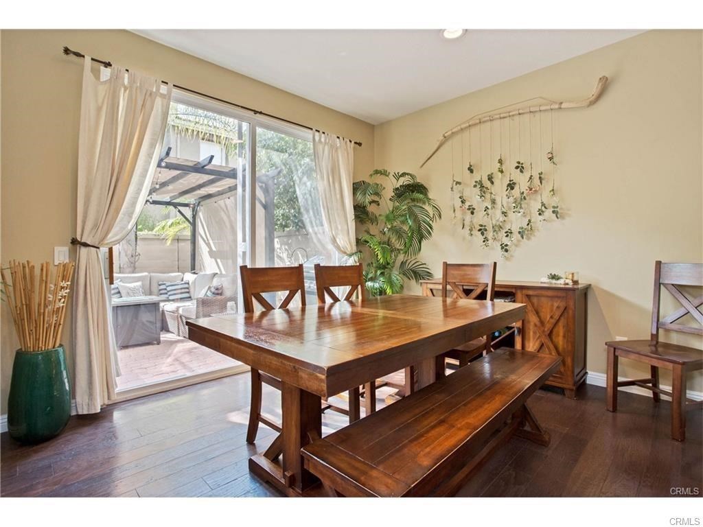 21 Corte Javier San Clemente, CA 92673 - Photo 7 of 32 a living room with a table a large window and potted plant