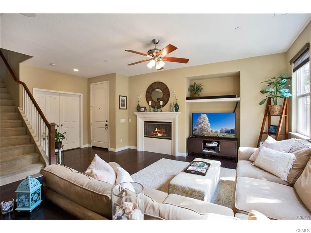 21 Corte Javier San Clemente, CA 92673 - Photo 8 of 32 a living room with furniture a flat screen tv and a fireplace
