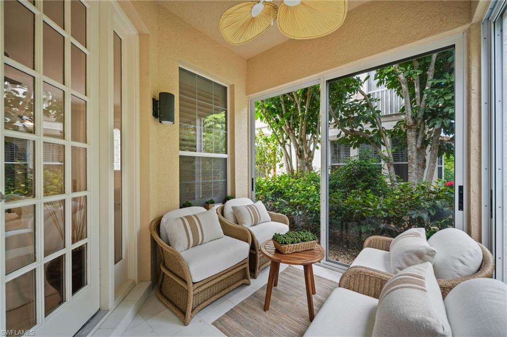 261 Colonade Circle, Unit 2701 Naples, FL 34103 - Photo 2 of 49 a view of balcony with furniture