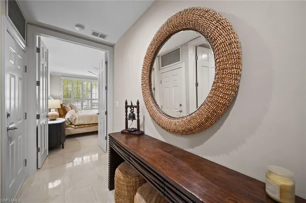 a view of living room and bathroom with a wooden floor