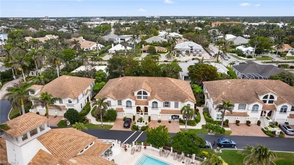 an aerial view of residential houses with outdoor space