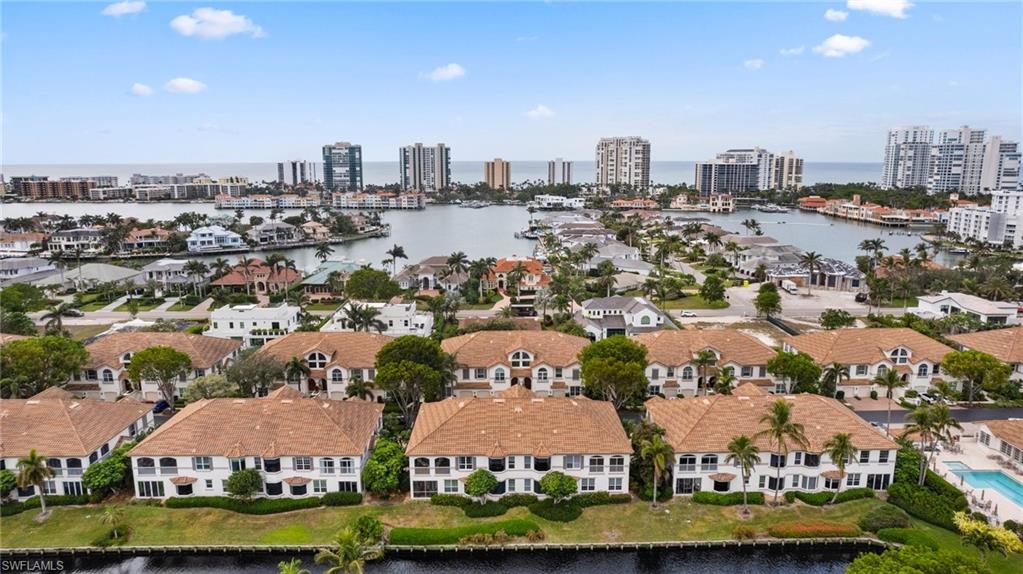 261 Colonade Circle, Unit 2701 Naples, FL 34103 - Photo 48 of 49 an aerial view of a city with lots of residential buildings