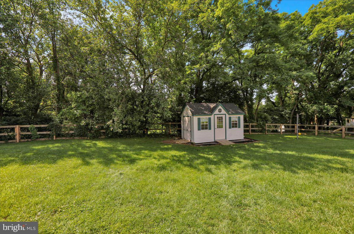208 Queens Gate Road Lititz, PA 17543 - Photo 45 of 49 a view of a tiny house with a big yard and large trees