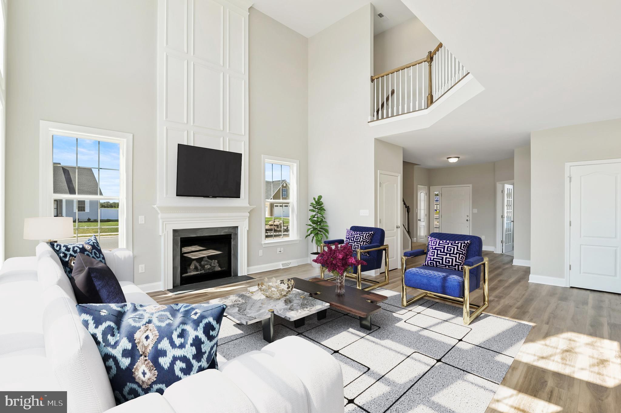 25 Georgetown Way Felton, DE 19943 - Photo 8 of 14 a living room with furniture fireplace and flat screen tv