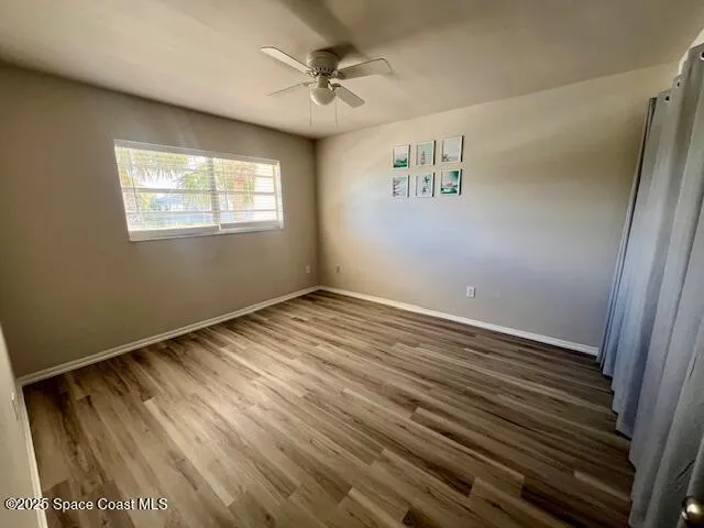 a bathroom with a sink toilet a mirror and shower curtain
