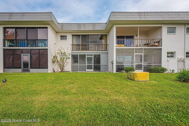 a view of a swimming pool and an outdoor seating