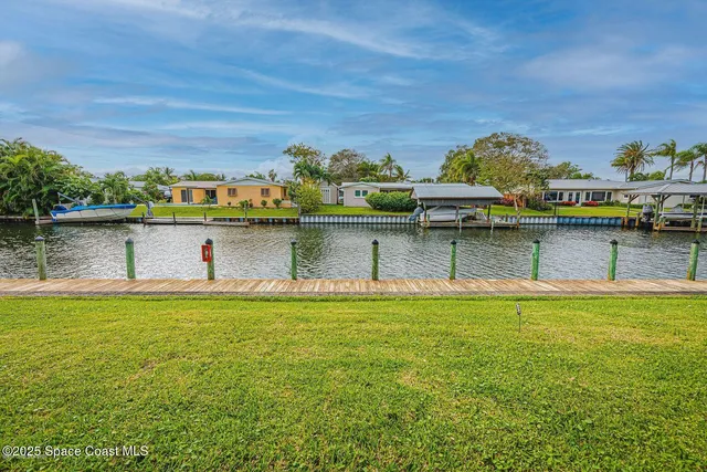 a view of a swimming pool with lounge chair
