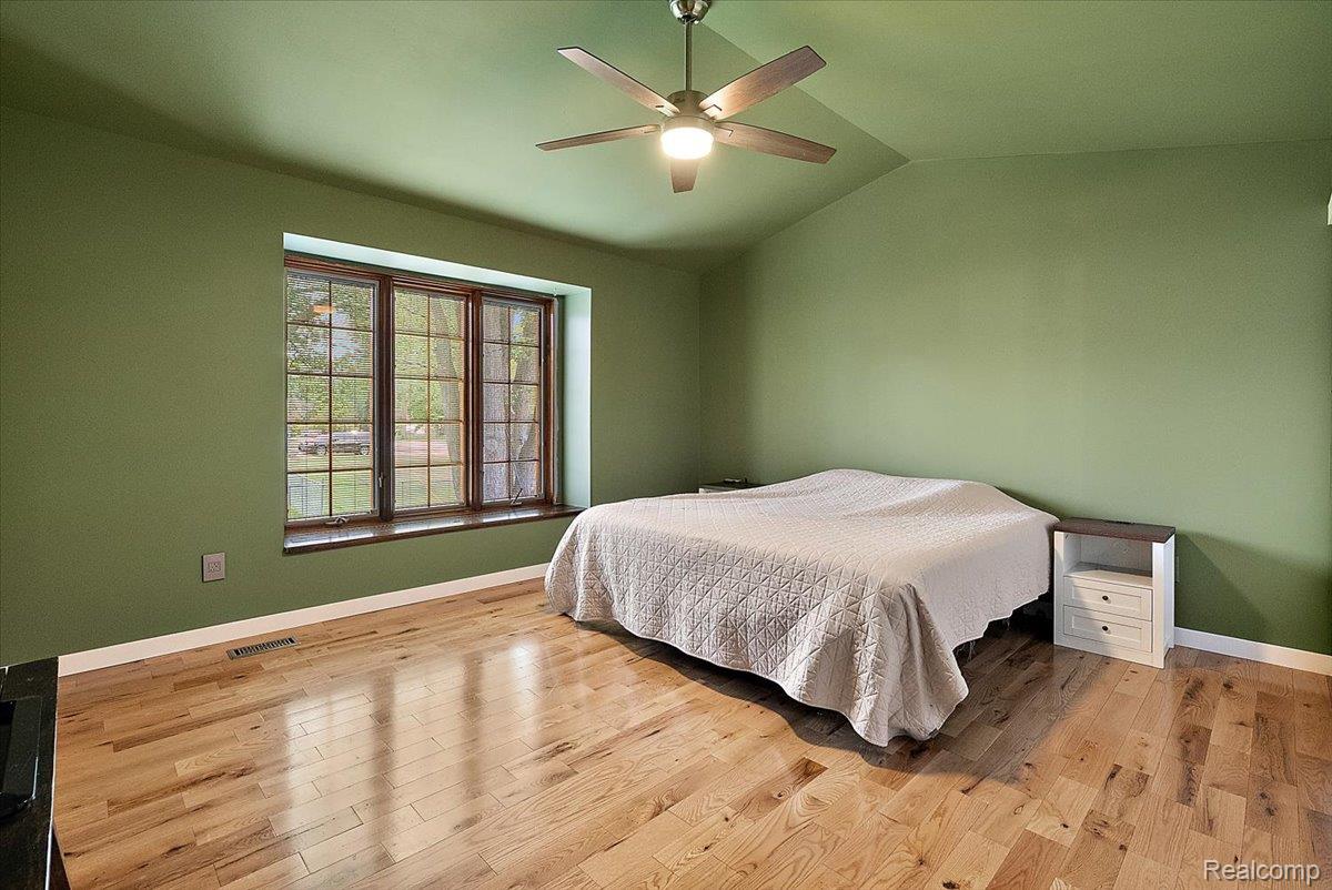 60718 Campground Road Washington, MI 48094 - Photo 20 of 37 Room featuring wood-finish flooring and a wood-trimmed window