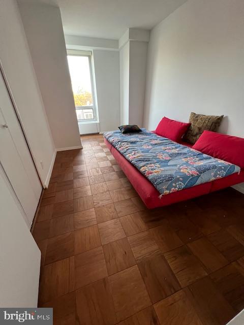 1425 4th Street Southwest, Unit A304 Washington, DC 20024 - Photo 11 of 25 a bedroom with a bed and window