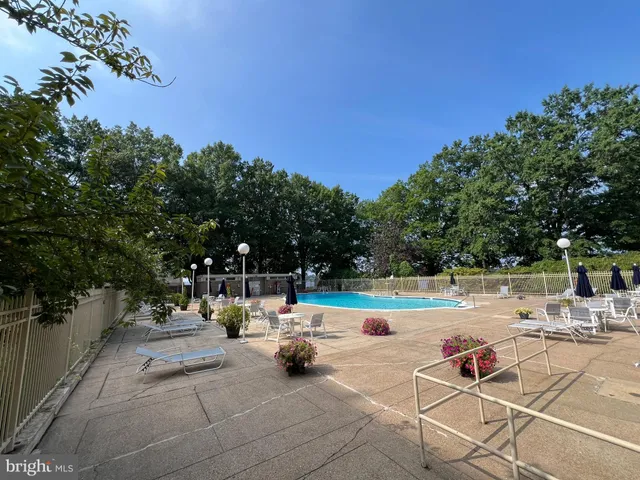 a view of a house with a backyard and a patio