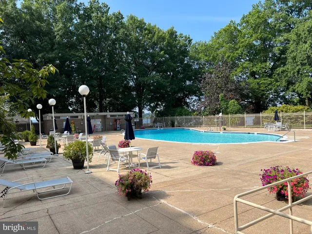 a view of a refrigerator with white cabinets