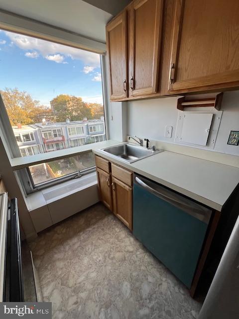1425 4th Street Southwest, Unit A304 Washington, DC 20024 - Photo 17 of 25 a kitchen with a stove a sink and a microwave