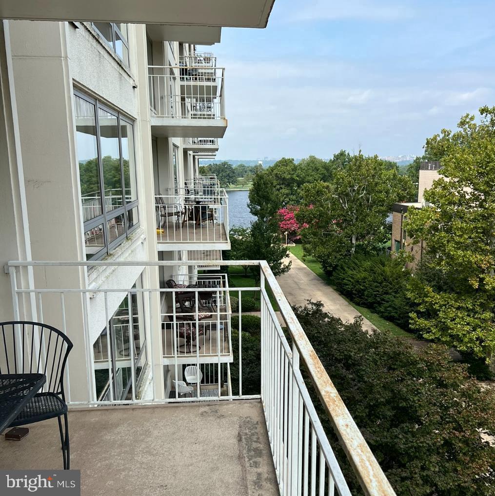 1425 4th Street Southwest, Unit A304 Washington, DC 20024 - Photo 2 of 25 a balcony with an outdoor seating