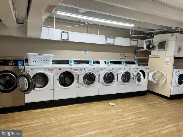 a view of a room with rack and wooden floor