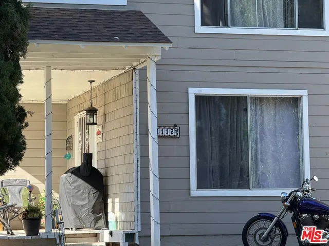 a front view of a house with a glass door