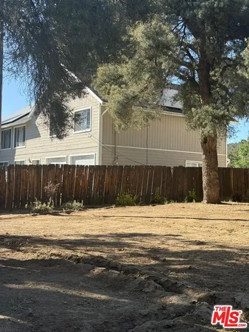 a view of a backyard of the house