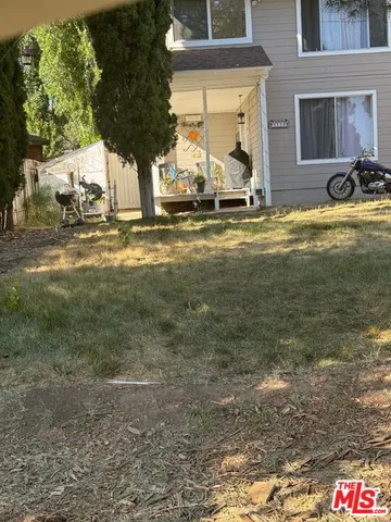 a view of swimming pool with outdoor seating