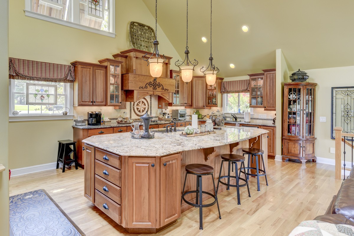 1069 Edgewater Circle Gallatin, TN 37066 - Photo 11 of 43 a kitchen with stainless steel appliances granite countertop a table chairs and a refrigerator