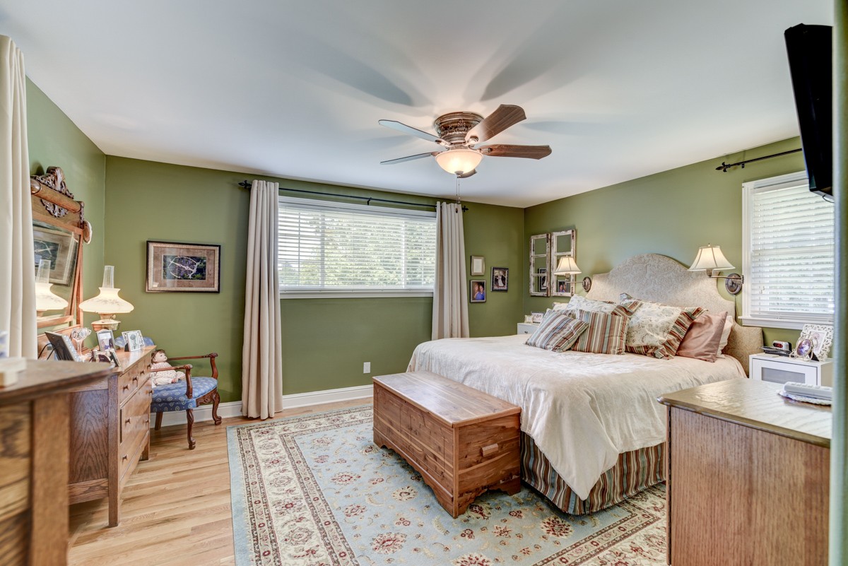 1069 Edgewater Circle Gallatin, TN 37066 - Photo 17 of 43 a bedroom with a bed and a chandelier