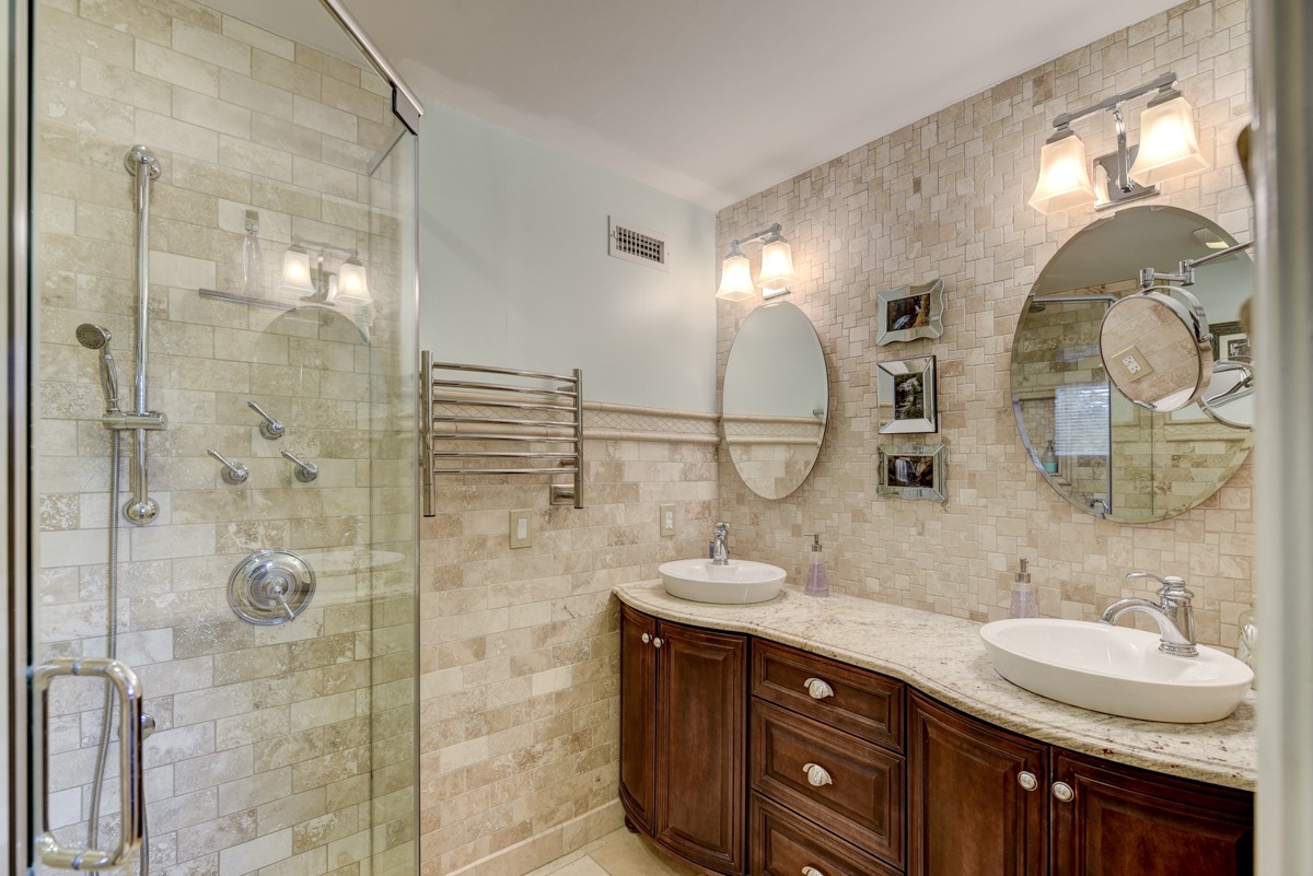1069 Edgewater Circle Gallatin, TN 37066 - Photo 19 of 43 a bathroom with a double vanity sink and a mirror