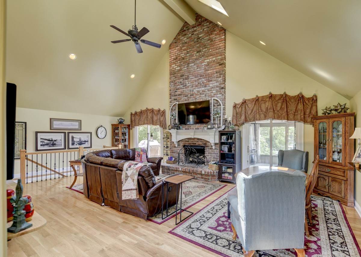 1069 Edgewater Circle Gallatin, TN 37066 - Photo 4 of 43 a living room with furniture a fireplace and a flat screen tv