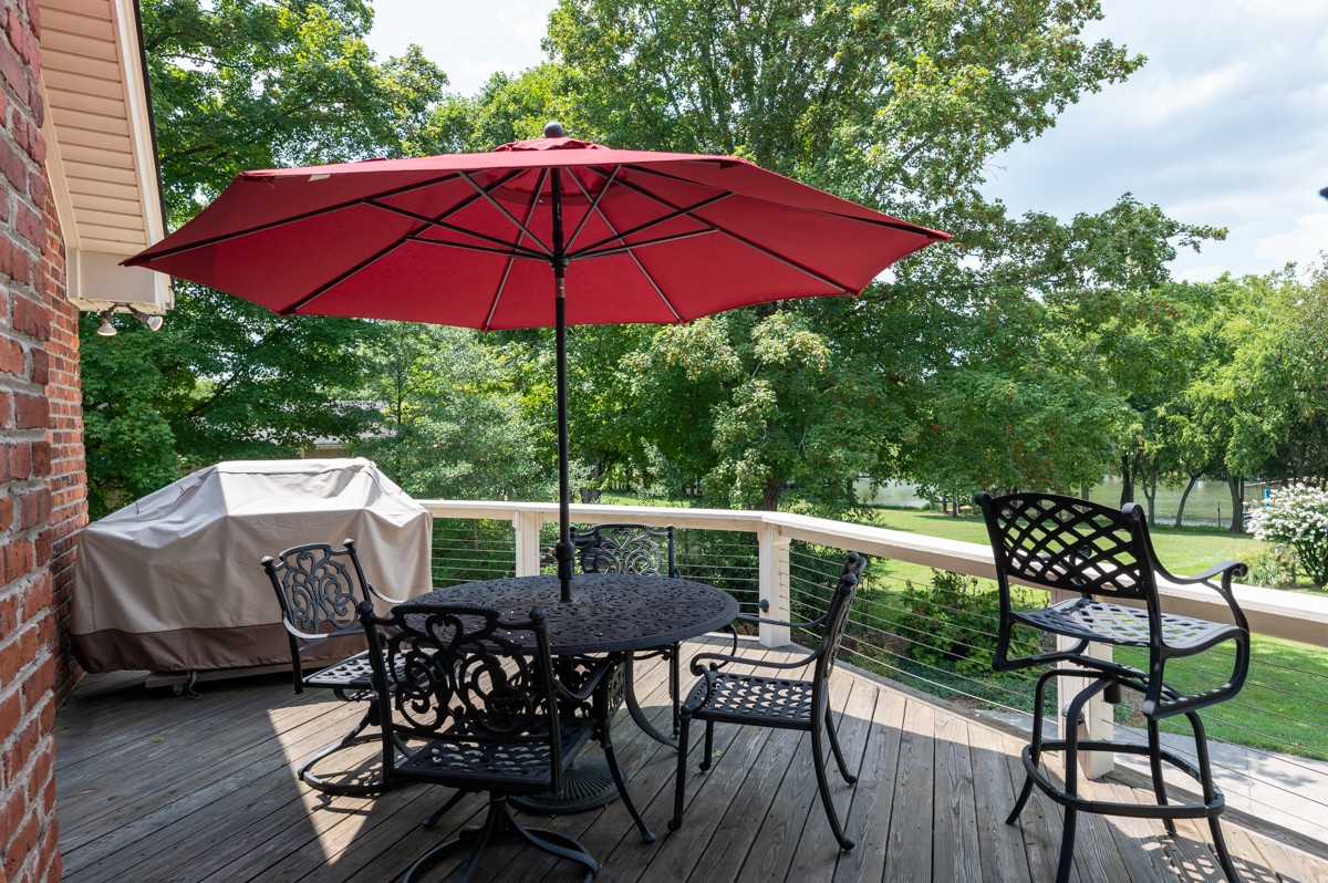 1069 Edgewater Circle Gallatin, TN 37066 - Photo 31 of 43 a view of an outdoor sitting area with furniture and umbrella