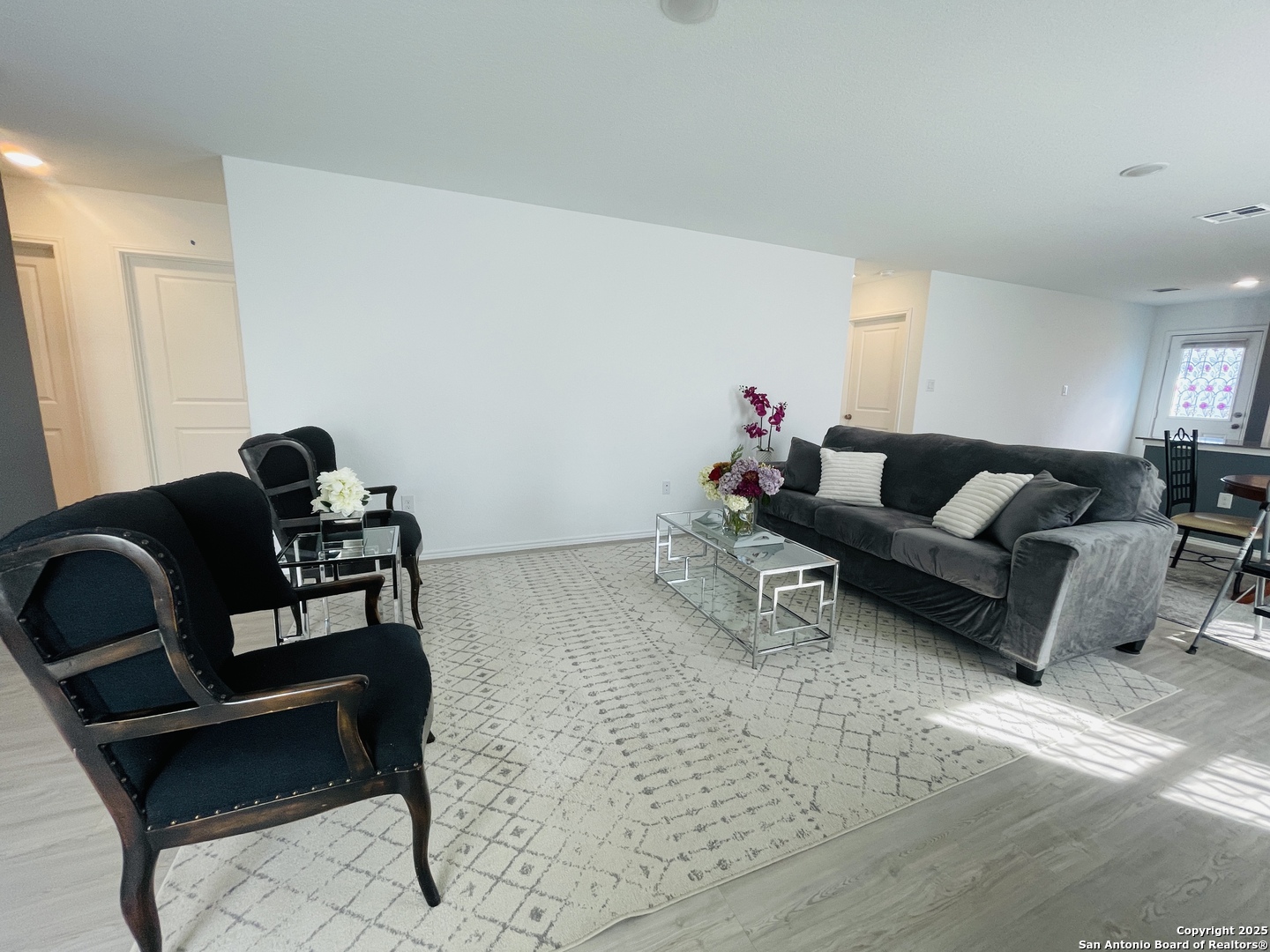 6948 Calcite Trail Elmendorf, TX 78112 - Photo 5 of 12 a living room with furniture and wooden floor