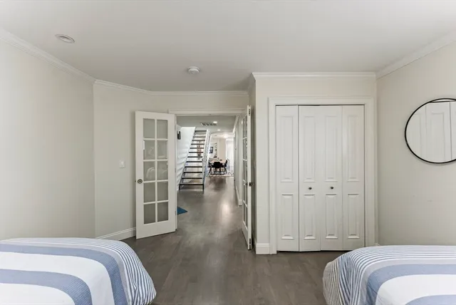 a bathroom with a sink mirror and toilet