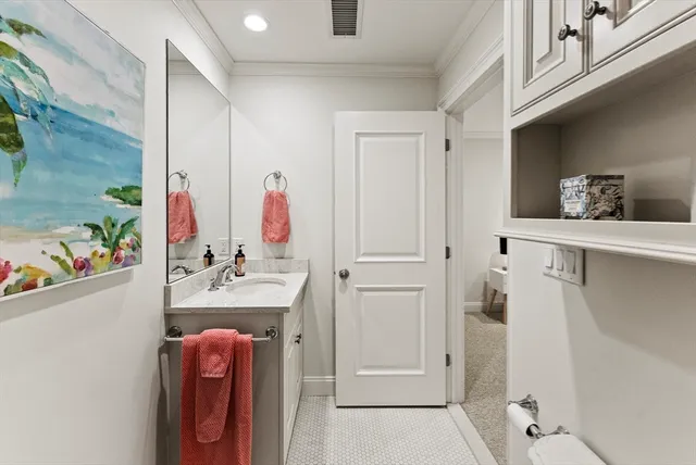 a bathroom with a tub a sink and a shower