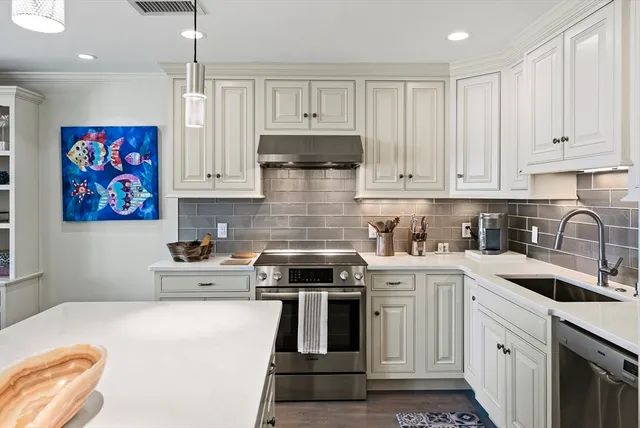 a kitchen that has a lot of countertop in it