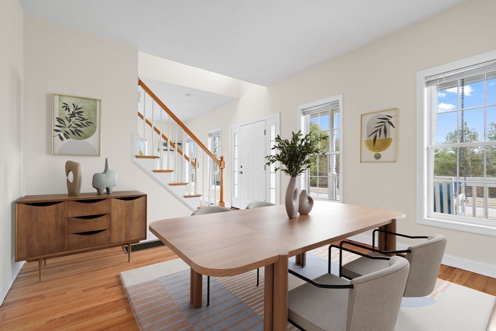 2 Northern Lights Way Bellingham, MA 02019 - Photo 17 of 40 a view of a dining room with furniture and wooden floor