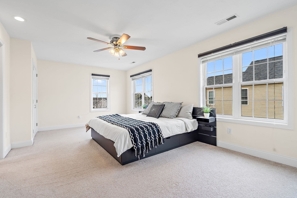 2 Northern Lights Way Bellingham, MA 02019 - Photo 18 of 40 a spacious bedroom with a bed and a window