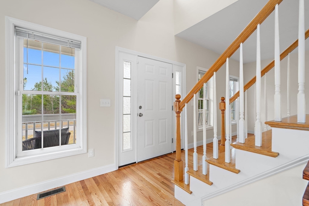 2 Northern Lights Way Bellingham, MA 02019 - Photo 19 of 40 a view of an entryway with wooden floor and door