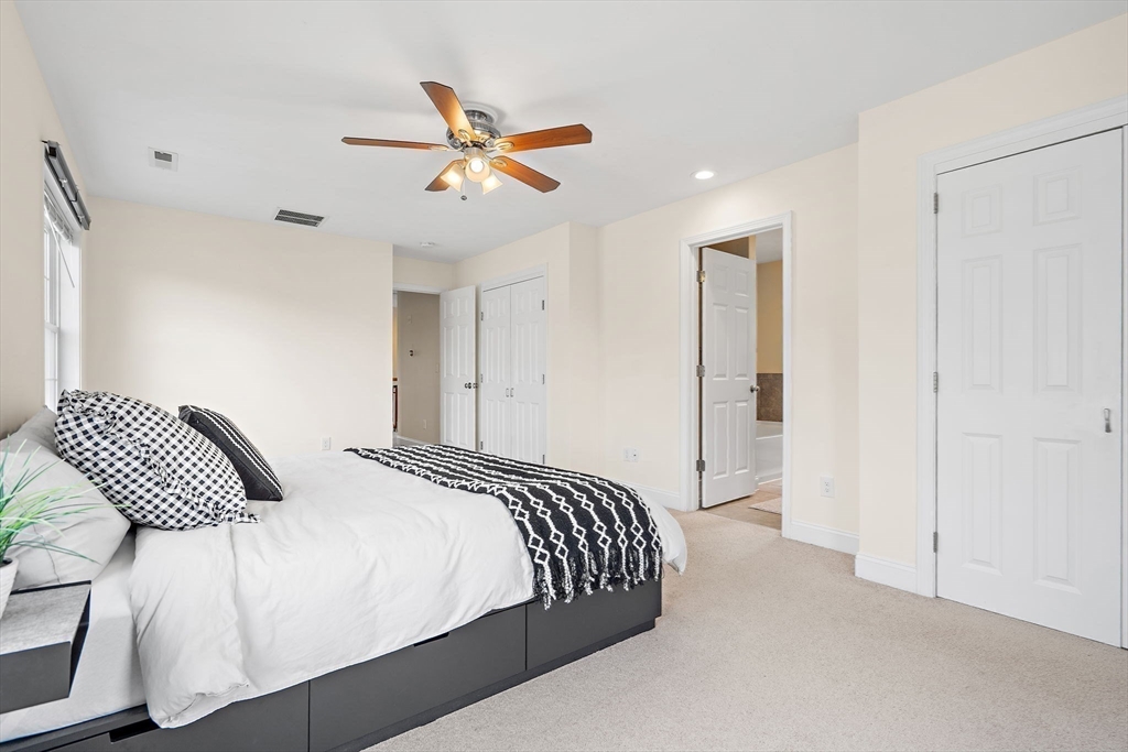 2 Northern Lights Way Bellingham, MA 02019 - Photo 21 of 40 a bedroom with a bed and a ceiling fan