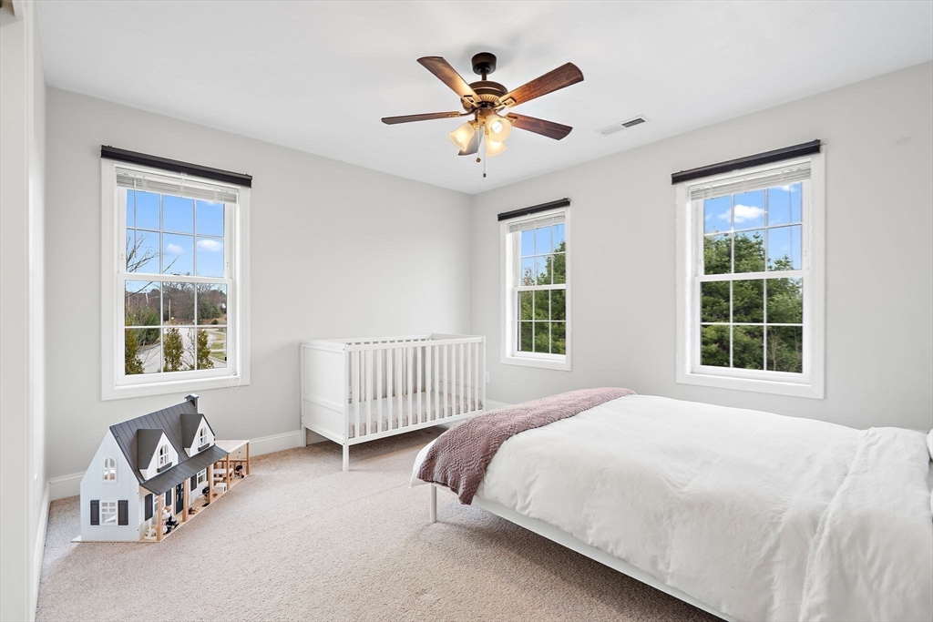 2 Northern Lights Way Bellingham, MA 02019 - Photo 24 of 40 a bedroom with a bed furniture and windows