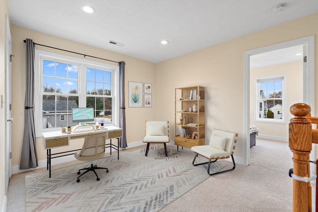 2 Northern Lights Way Bellingham, MA 02019 - Photo 30 of 40 a living room with furniture and a table