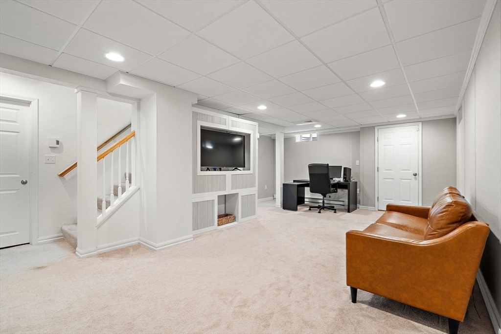 2 Northern Lights Way Bellingham, MA 02019 - Photo 34 of 40 a living room with furniture and a flat screen tv