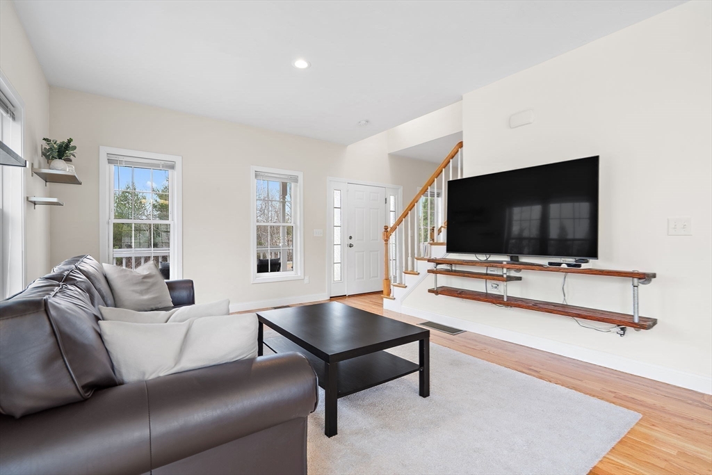 2 Northern Lights Way Bellingham, MA 02019 - Photo 6 of 40 a living room with furniture and a flat screen tv