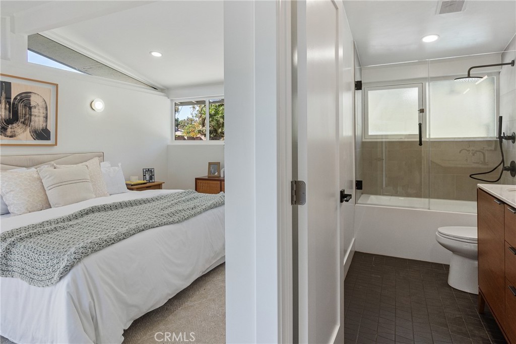 6909 De Celis Place Van Nuys, CA 91406 - Photo 17 of 46 a bedroom with a bed and a view of bathroom