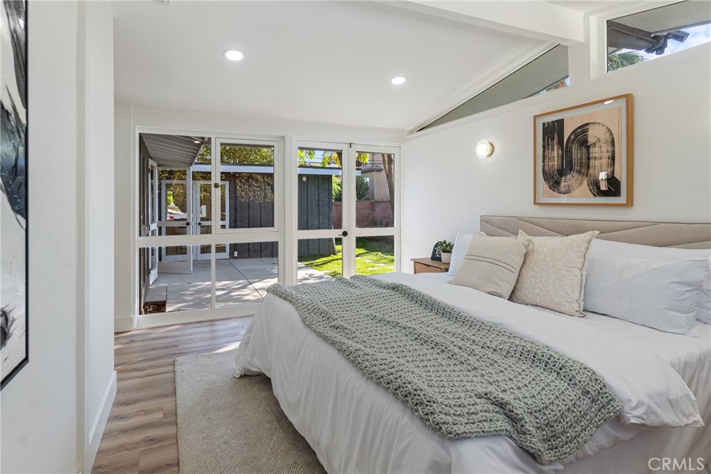 6909 De Celis Place Van Nuys, CA 91406 - Photo 18 of 46 a bedroom with a bed and a large window
