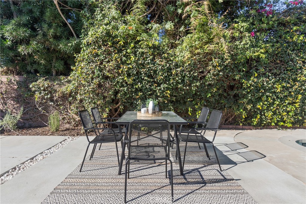 6909 De Celis Place Van Nuys, CA 91406 - Photo 33 of 46 a view of a chairs and table in the patio