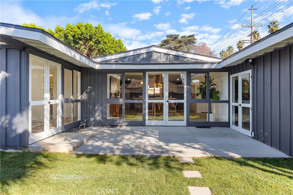 6909 De Celis Place Van Nuys, CA 91406 - Photo 39 of 46 a view of a house with pool and porch with furniture
